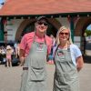 Two people standing outside the cafe