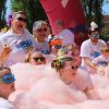 A family enjoying a bubble station at a family fun run Bubble Rush 