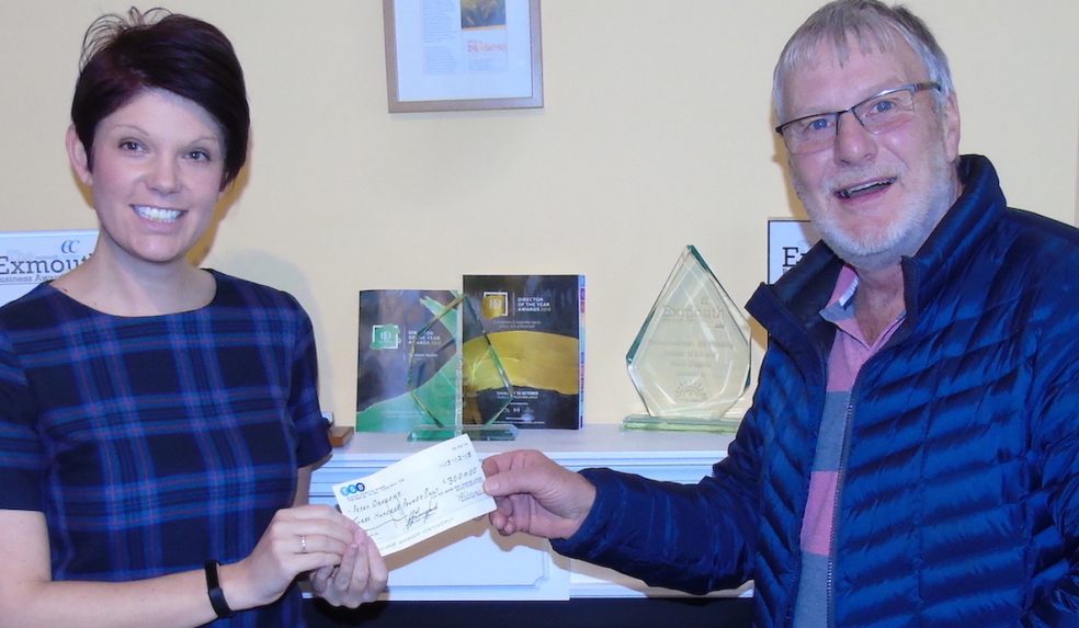 Tom Devin of the Per Mare Per Terram Masonic Lodge No 9355 presents a cheque for £300 to Pete’s Dragons project manager Kate Bedding.  