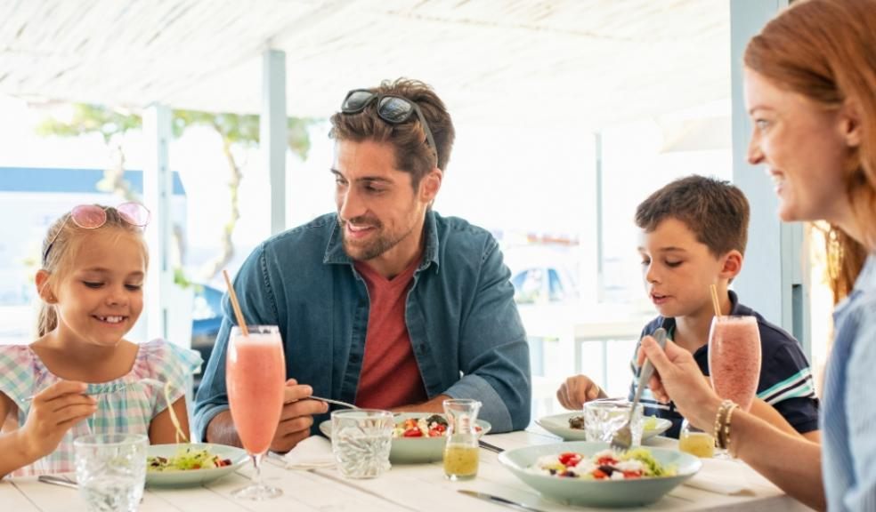 young family eating out