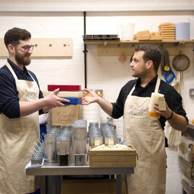 Two men making candles