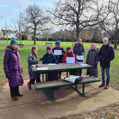 Happy people standing together in the park