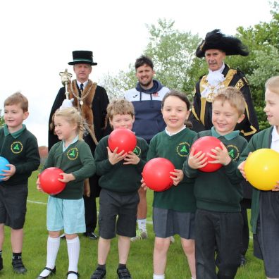 Children from Trinity C of E Primary School are pictured with (L-R) Senior Mace Sergeant John Davies; Dominic Goodhew, CITY Community Trust PL Primary Stars coach; and the new Lord Mayor of Exeter Cllr Peter Holland