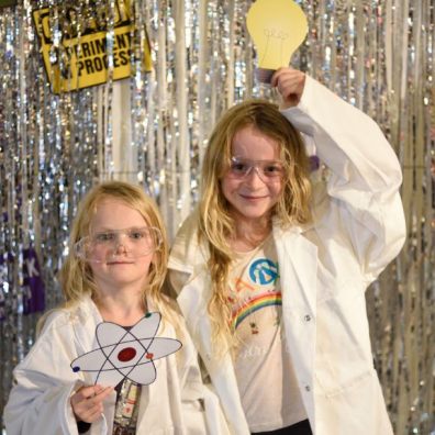 Two children take part in a science event