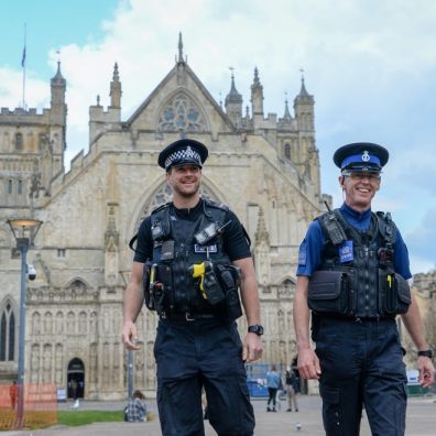 two policemen stand-in outside Exeter Cathedral