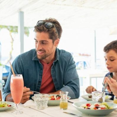 young family eating out